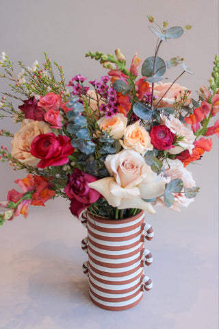 V-Day arrangement in a striped vase