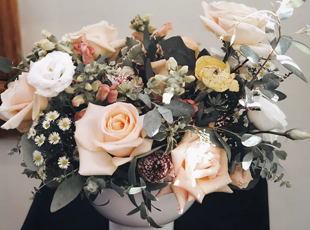 Floral arrangement in a contemporary white compote